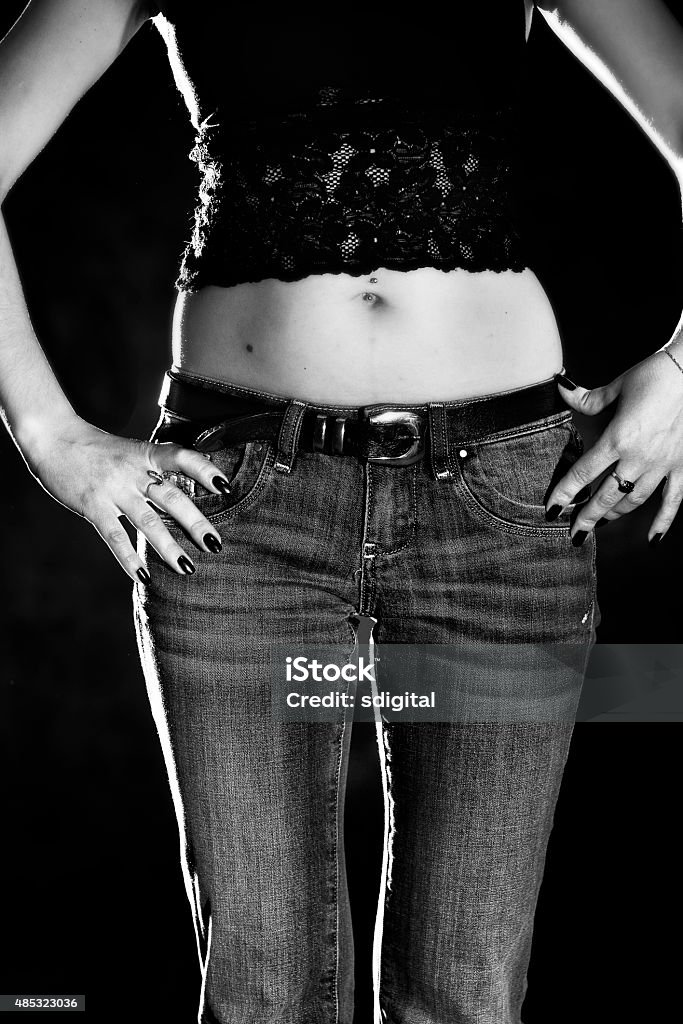 Slender woman in jeans Lower body part of slender woman in jeans in black and white colors, Sexy girl, Erotic 2015 Stock Photo