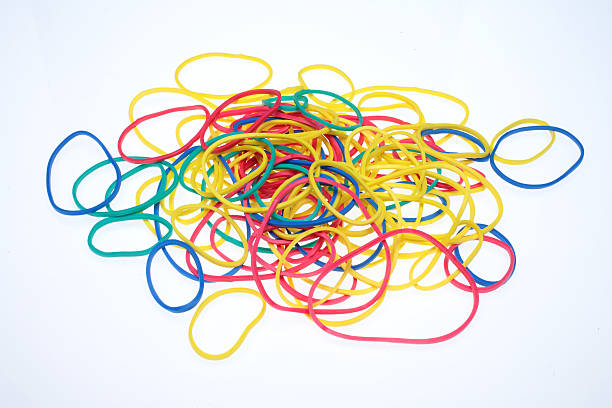 istock lot of colorful rubber bands over white 485328766