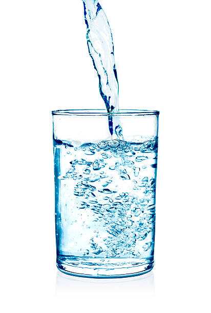 istock Clear water being poured into a glass cup 485330246