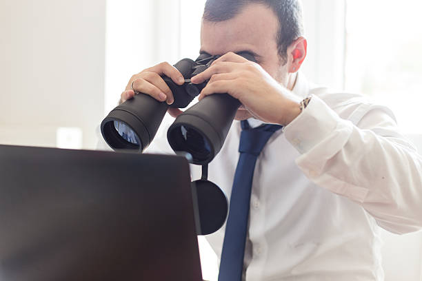 istock Businessman using binoculars for finding business profit 485331382