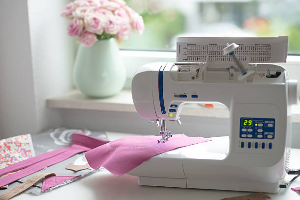 istock view of sewing room with sewing machine, fabric, flowers 485331570
