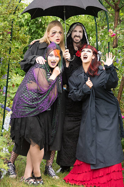 4 vampires, huddling under an umbrella, cursing the rain.