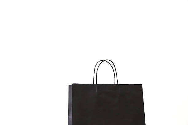 istock black. recycle shopping bag with handles isolated on white 485332414