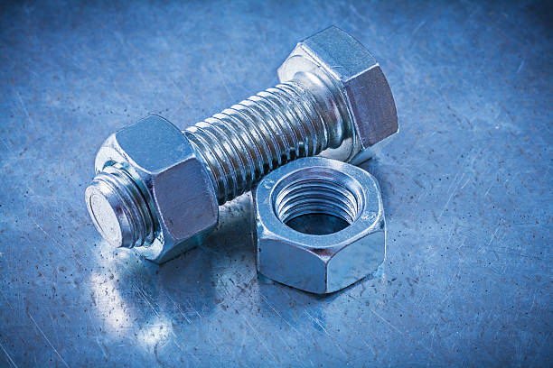 istock Screwbolt and construction nuts on metallic surface close up vie 485332830