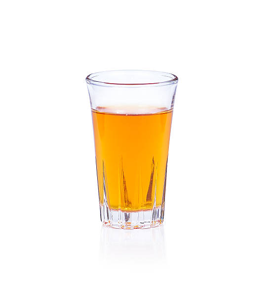 istock Whiskey in a shot glass isolated on a white background 485334808