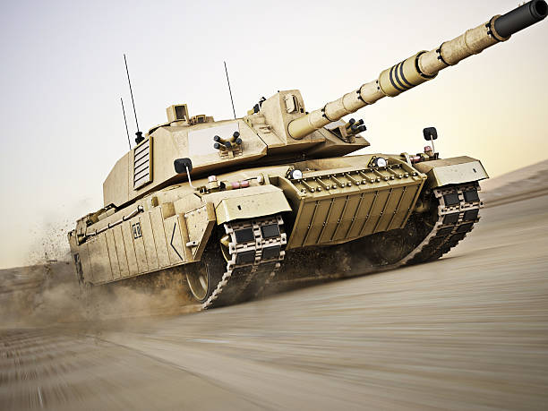 Military armored tank Military armored tank moving at a high rate of speed with motion blur over sand. Generic photo realistic 3d model scene. battlefield photos stock pictures, royalty-free photos & images