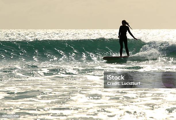 Surfer Girl Rides Wave Stock Photo - Download Image Now - 2015, Adolescence, Adult