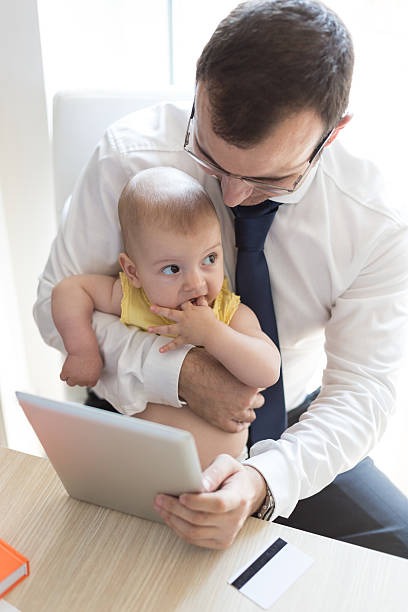 istock Father With Baby Working In Office At Home 485335640