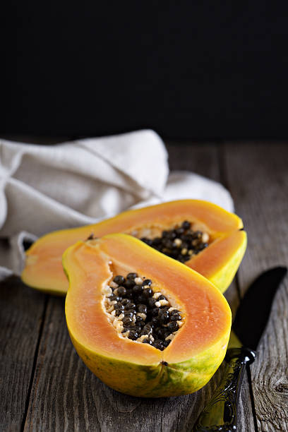 istock Cut papaya on a wooden table 485336234