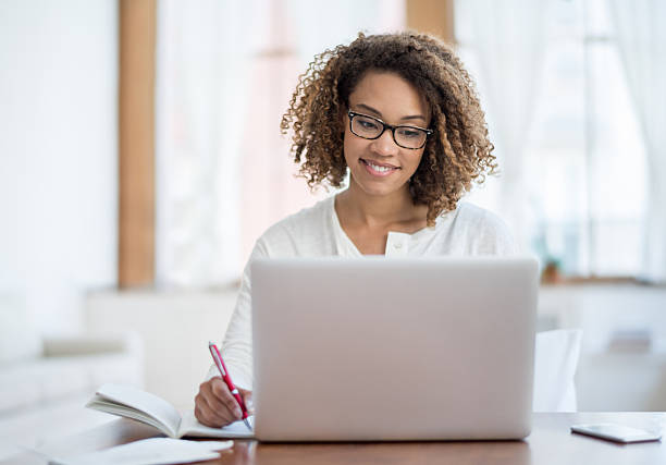Young black woman working at home