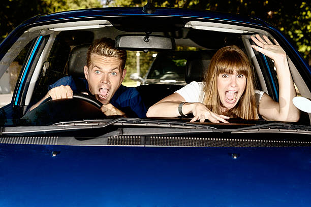 istock Watch out! Panic-stricken young couple try to avoid auto accident 485338283