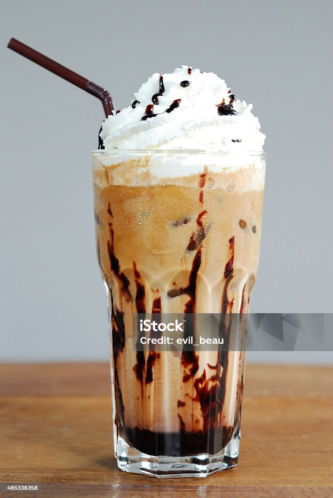 Ice coffee Ice coffee with cream on table Coffee Frappe Stock Photo