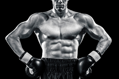 Boxer muscular torso isolated on black background