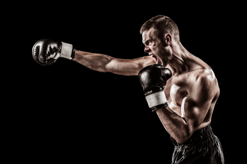 Caucasian boxer isolated on black