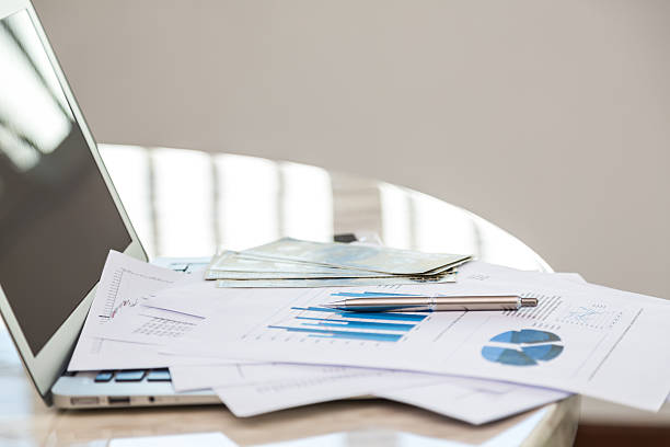 istock Financial charts on the table with laptop 485342356