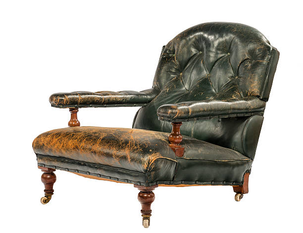 istock Antique green leather low arm chair isolated on white 485343980