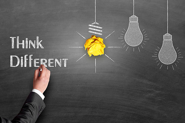 istock Businessman's hand drawing think different concept on chalkboard 485344374