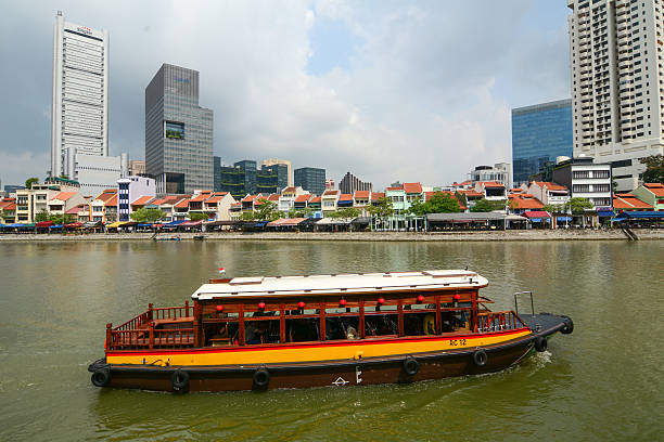 A bumboat plying through Singapore River