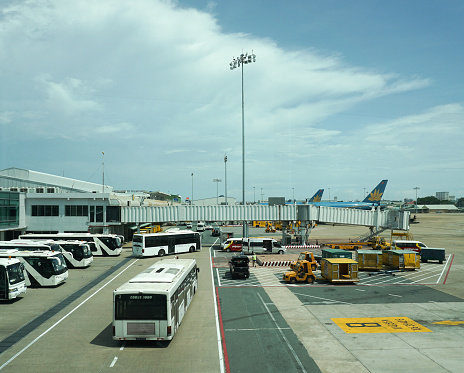 Bangkok, Thailand - July 2, 2015: Some vehicles running inside Don Muang International Airport. Don Muang is a regional commuter flight hub in Bangkok, Thailand.