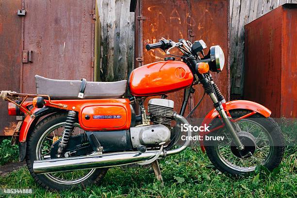 Vintage Red Motorcycle Generic Motorbike In Countryside Stock Photo - Download Image Now