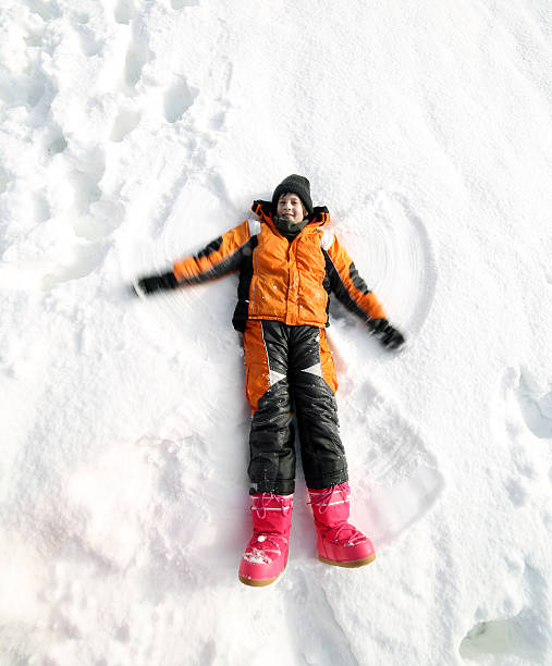 istock child makes the shape of the Angel 485347280