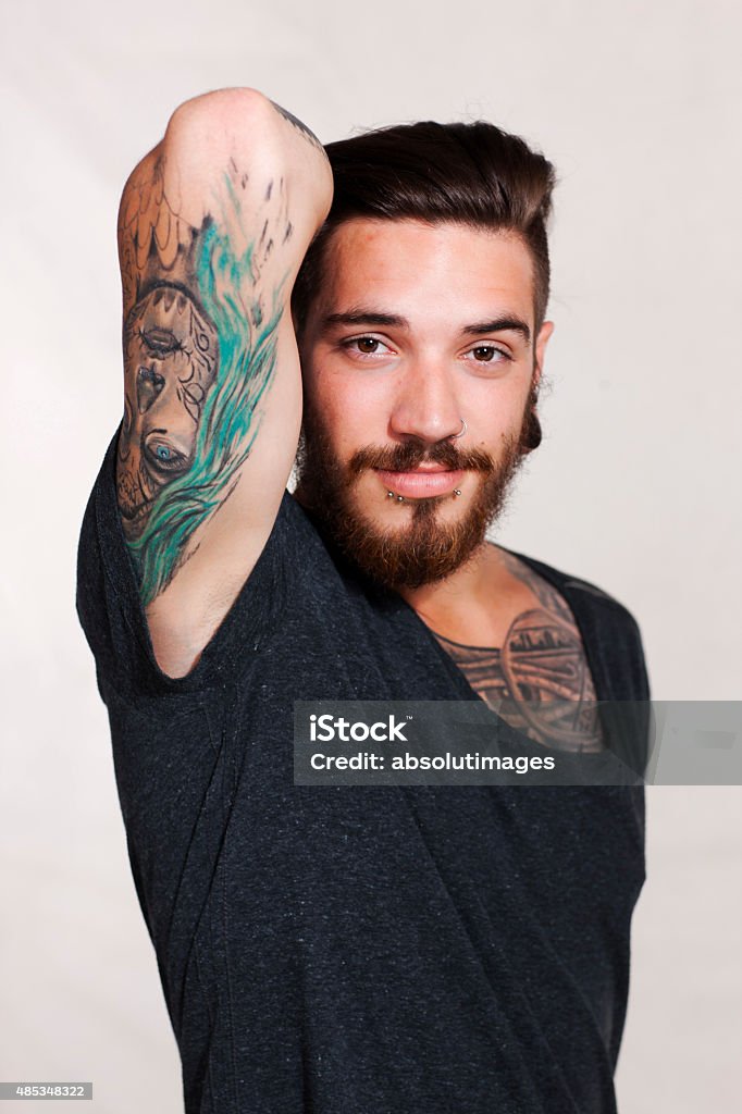 Serious Young Urban Man With Tattoo Stock Photo - Download Image Now -  2015, Adult, Beard - iStock