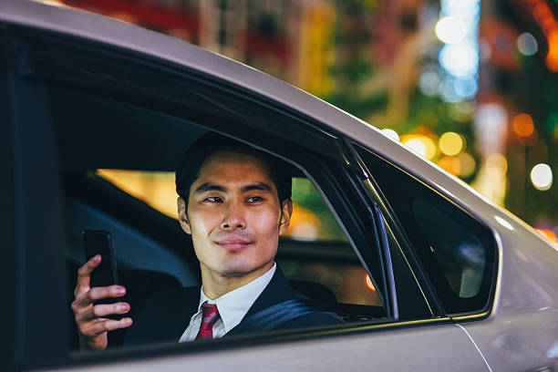 istock Businessman texting in a car 485348370