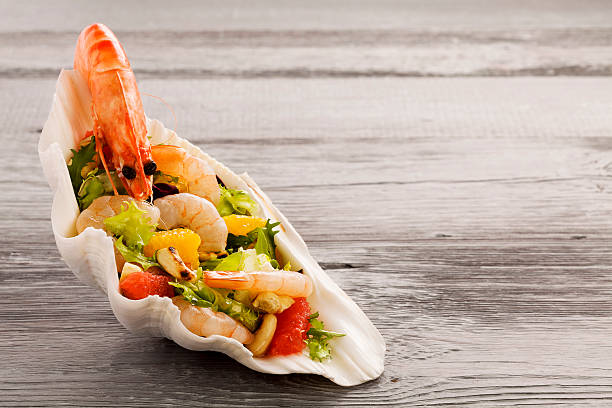 istock Shrimp salad with grapefruit, orange and roasted peanuts. - Serv 485349106