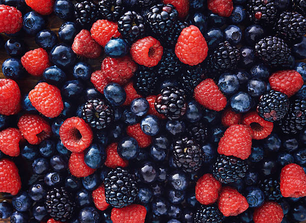 blueberies, raspberries and black berries shot top down stock photo