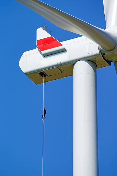 istock Man to abseil on a big wind turbine 485349426
