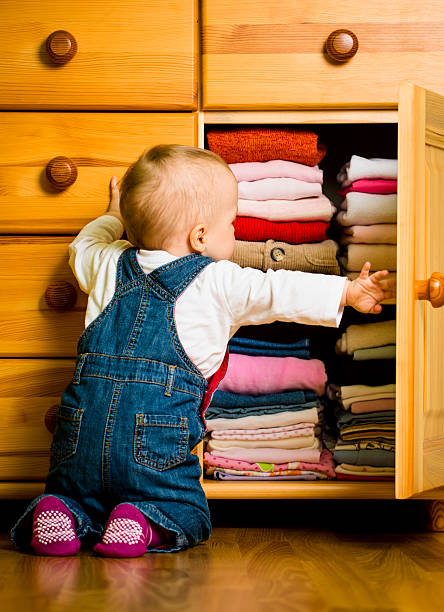 istock Domestic chores - baby throws out clothes 485349588