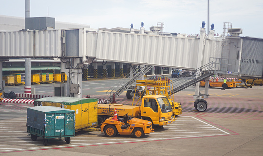 Bangkok, Thailand - July 2, 2015: Some vehicles running inside Don Muang International Airport. Don Muang is a regional commuter flight hub in Bangkok, Thailand.