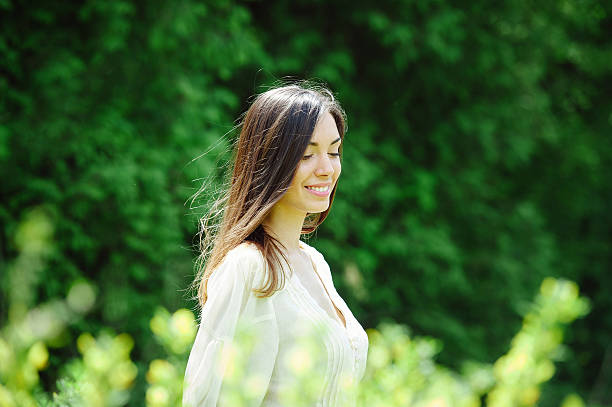 istock Beautiful young woman in spring garden 485355768