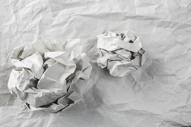 istock old white paper texture with paper ball background 485358432