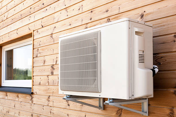 istock Exterior airconditioning unit on a wooden wall 485358614