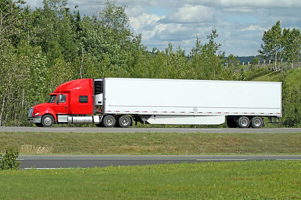 istock Semi Truck Transporting Freight On An Interstate Highway, Side View 485362100