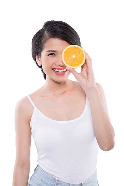 istock Pretty girl with orange 485362590