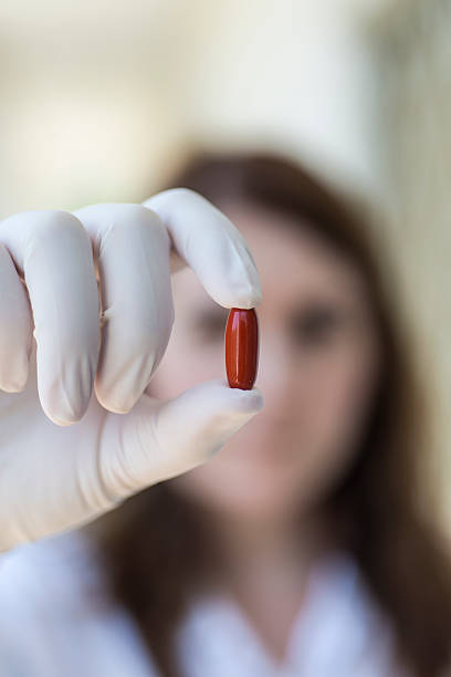 istock Doctor holding red pill capsule 485363060