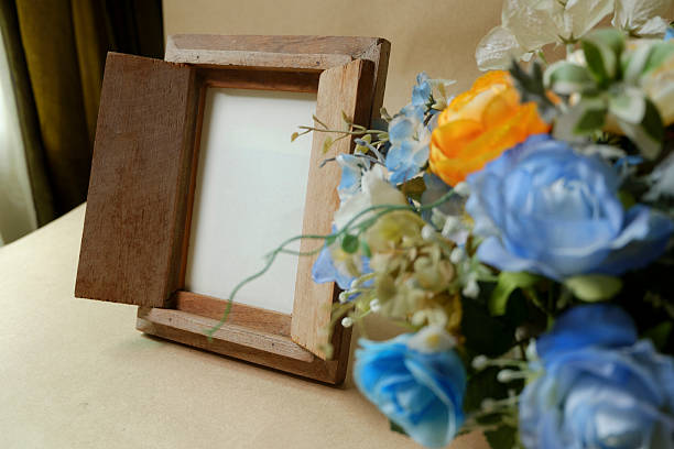 istock Vintage photo frame on wooden table over grunge background 485363082