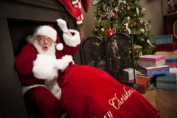 istock Real Santa Crawling Out of The Fireplace 485363360