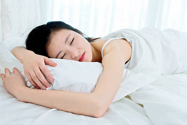istock Beautiful young asian woman sleeping 485363526