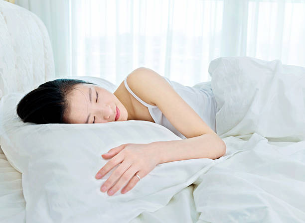 istock Beautiful young asian woman sleeping 485363534
