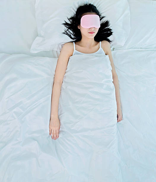 istock woman sleeping in sleep mask 485363580