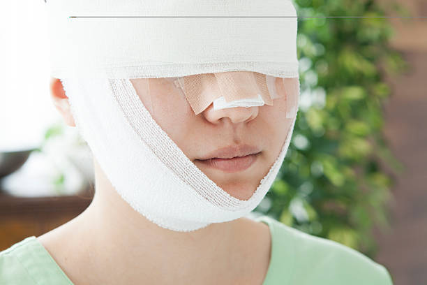 istock Female face wrapped in bandages 485365078