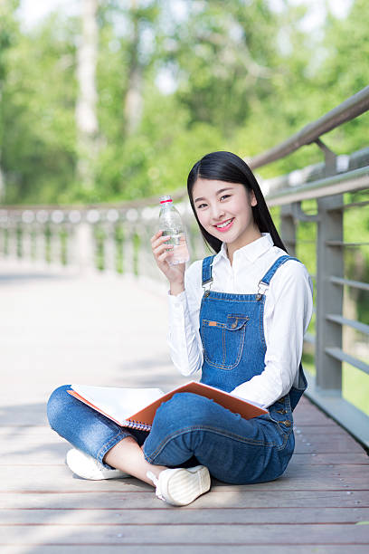 istock happy girl drinking water 485365410