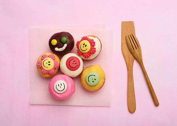 istock The Many Small Cupcake and wood tool on pink background 485367098