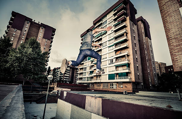istock Young man practicing parkour in the city 485367402