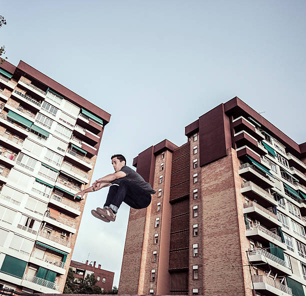 istock Young man practicing parkour in the city 485367424