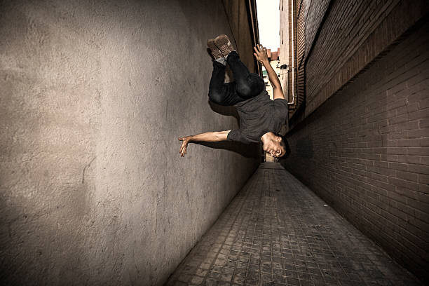 istock Young man practicing parkour in the city 485367428