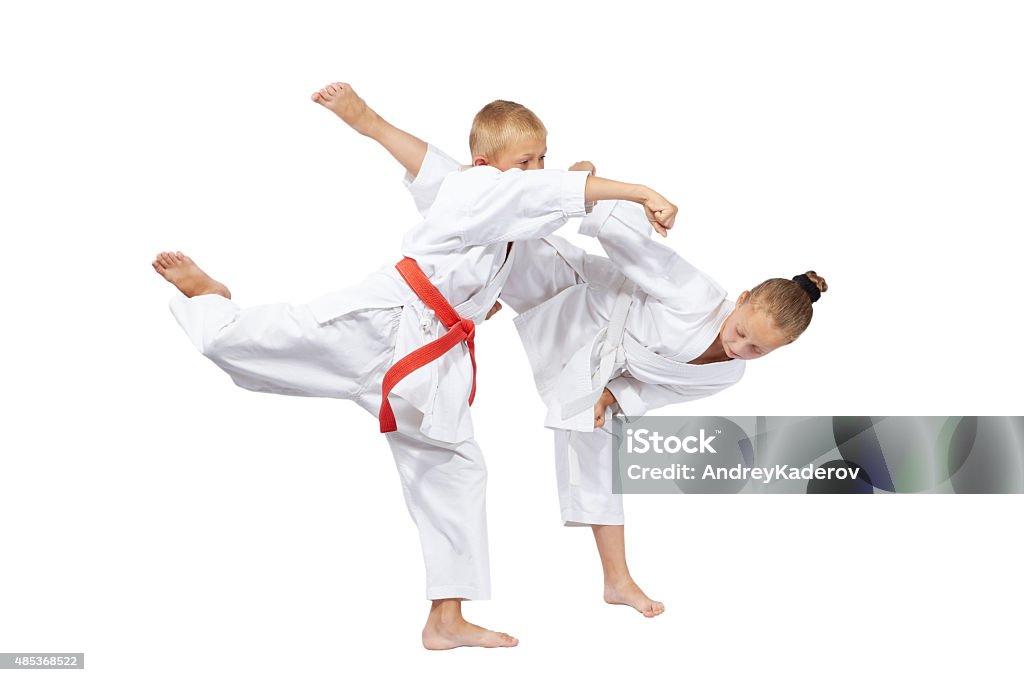 Boy and girl are trained karate blows 2015 Stock Photo